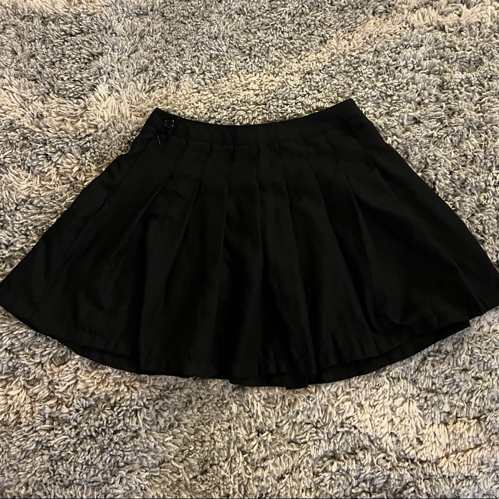 Pleated black mini skirt